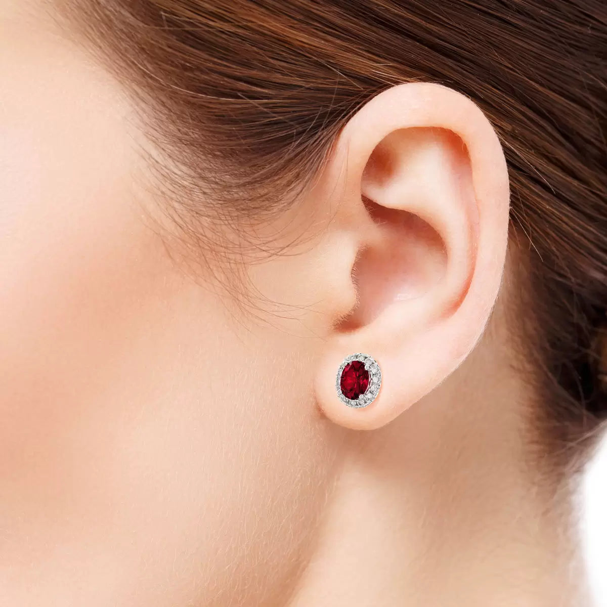 Oval Cut Ruby & 0.16ctw Diamond Halo Earrings, 14ct White Gold