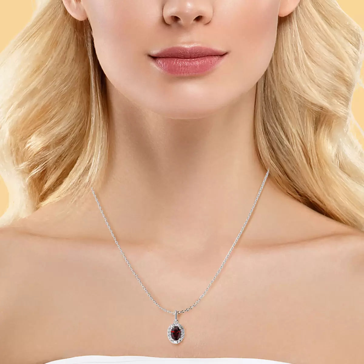Oval Cut Ruby & 0.10ctw Diamond Halo Pendant, 14ct White Gold